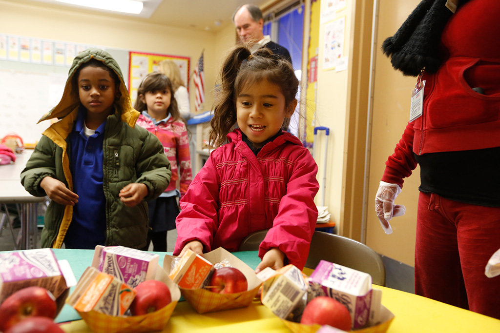 girl getting school breakfast